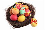 Easter nest with colored eggs, isolated on white background