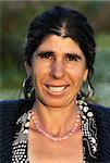 Portrait of a happy and smiling gypsy lady, looking at the camera