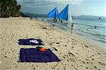 tourists enjoying beach of boracay island in the philippines