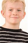 Portrait of a little boy posing on white background