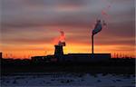 The landscape of industrial.Thermal power station in the rays of the setting sun. Romantic rays of the setting sun.
