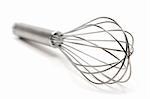 Metal wire whisk. Shallow depth of field. White background.