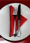 A modern restaurant table setting in red