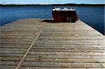 Table with champagne and glasses on a lake coast