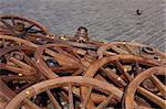 Cart wheels on the old town square. Cobblestone background.