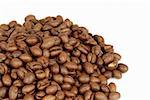 Detail of freshly roasted coffee beans heap isolated