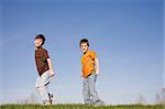 Two Little Boys Walking on a Hill