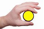 Man's hand holds a yellow optical filter. Isolated on white [with clipping path].