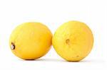 close-up of two fresh lemons on white background
