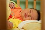 sleeping newborn baby in the bed