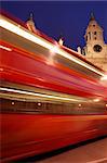 Blurred red London bus. St Paul's Cathedral in background