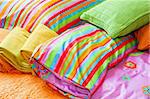 Colorful bedding pillows and blankets with straps