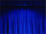 Blue Theater Curtain With Spot Light on