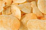 Background of chips and crisps with flavoring powder