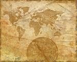 Ancient map of the world. The torn, scorched edges. Compass.