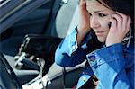 angry woman with mobile phone in her car