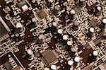 A macro shot of a black circuit board.