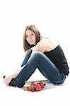 Beautiful young woman with red grape. Isolated