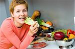 Young woman eating fresh salad. Healthy lifestyle concept