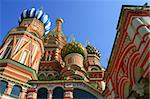 Multi-coloured domes of bright fairy church, red brick, Moscow