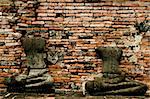 two decapitated buddhas in the ruins of the ancient thai capital of ayutthaya