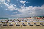 Umbrellas and seats populate the beautiful beach of viareggio beach in tuscany