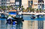 Maltese boats in a bay during summer day