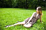 Young Beautiful Woman Relaxing In The Park