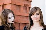 Teenagers Portrait On The Brick Background