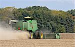 Harvesting soybeans with a combine on an autumn day