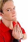 male looking at camera while praying on an isolated background