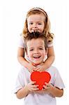 Happy kids hugging and holding a red heart - isolated