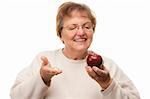 Happy Attractive Senior Woman Holding Apple and Vitamins Isolated on a White Background.