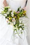 bouquet with orchids in the hands of the bride