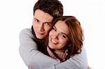 Young attractive couple passionately in love holding isolated on white