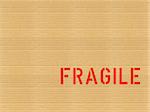 Word Fragile written on a corrugated cardboard packet