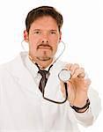 Doctor holding out his stethoscope.  Shallow depth of field with focus on hand holding the end of stethoscope.