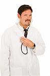 Handsome doctor listening to his own chest with a stethoscope.  Isolated on white.