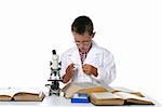 child scientist looking at slide for the microscope