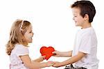 Two happy kids holding hands and a red heart - isolated