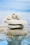 Sea pebble and quiet waves on a summer beach