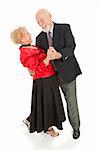 Romantic senior couple dancing together.  He's dipping his beautiful wife.  Full body isolated.