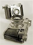 Two antiquarian 35-mm film cameras.