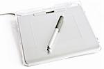 Graphic tablet with pen on white background