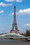 View at Eifel tower and railway bridge (Pont Rouelle) crossing island (Ile des Cygnes) in Paris