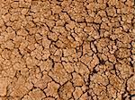 A baked earth soil after a long drought.
