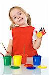 Happy little painter girl with smeary hand vawing - isolated