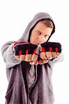 young male showing fists against white background