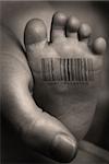 Babies foot with barcode