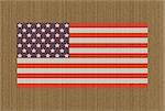 Illustration of an American flag over cardboard background